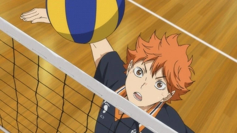 Hinata alcança a bola acima da rede; alcance e altura do salto são medidas diferentes.