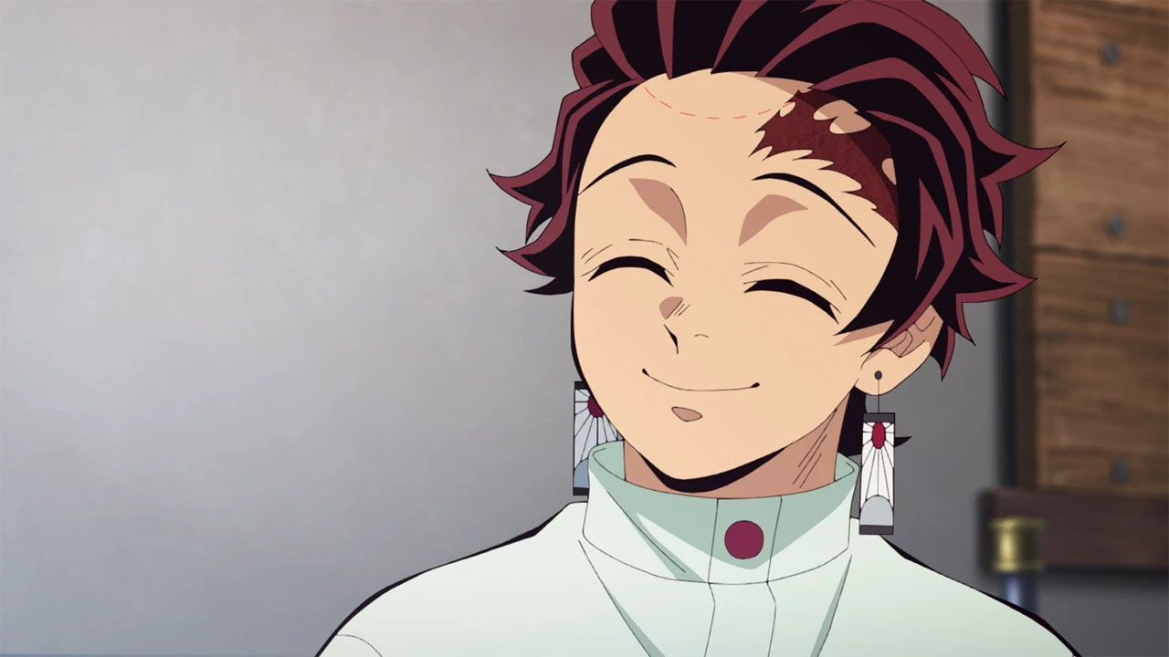 Tanjiro sorri de olhos fechados em Demon Slayer